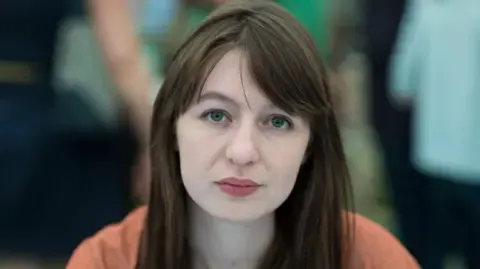 Sally Rooney claims she is unable to travel to the UK because of legal concerns